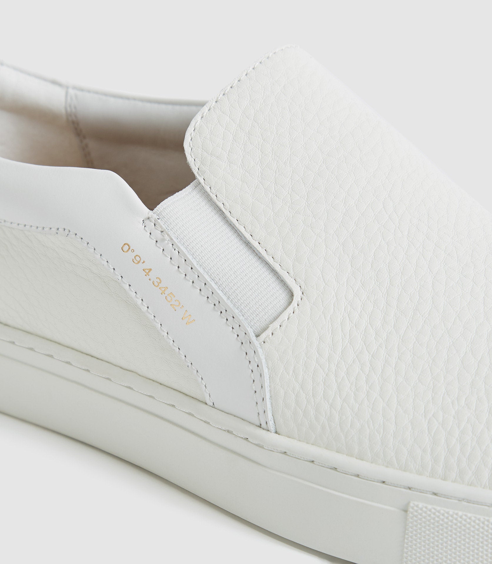 slip on white leather trainers