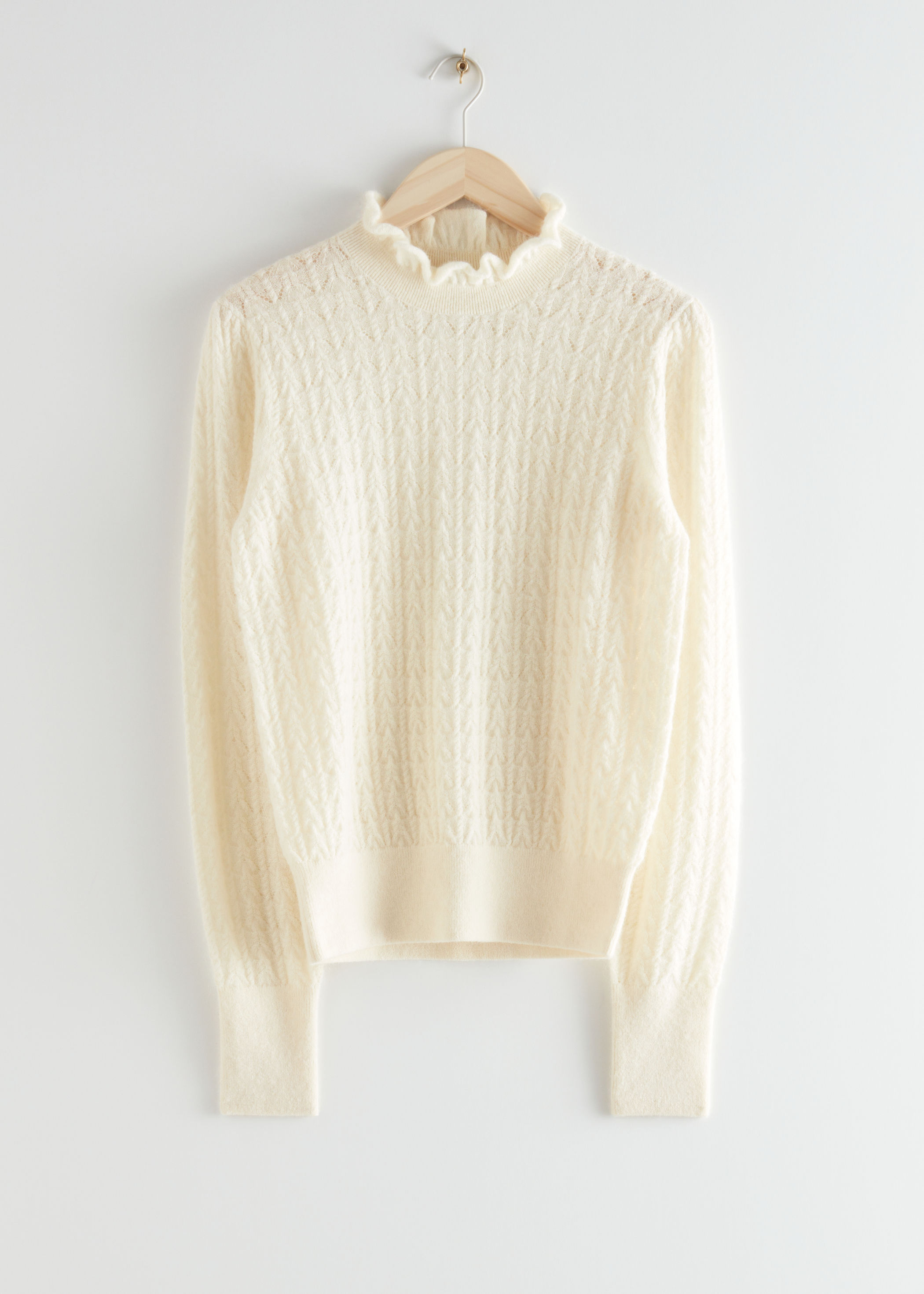 cable knit sweater with ruffles