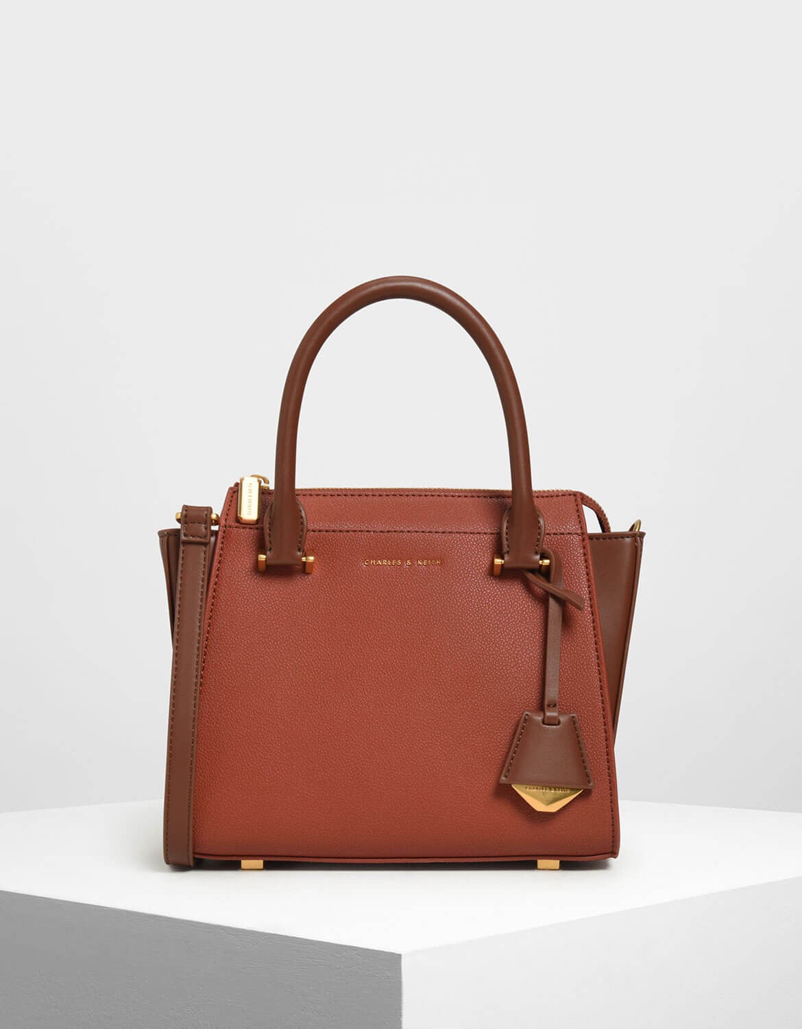 charles and keith boxy trapeze bag