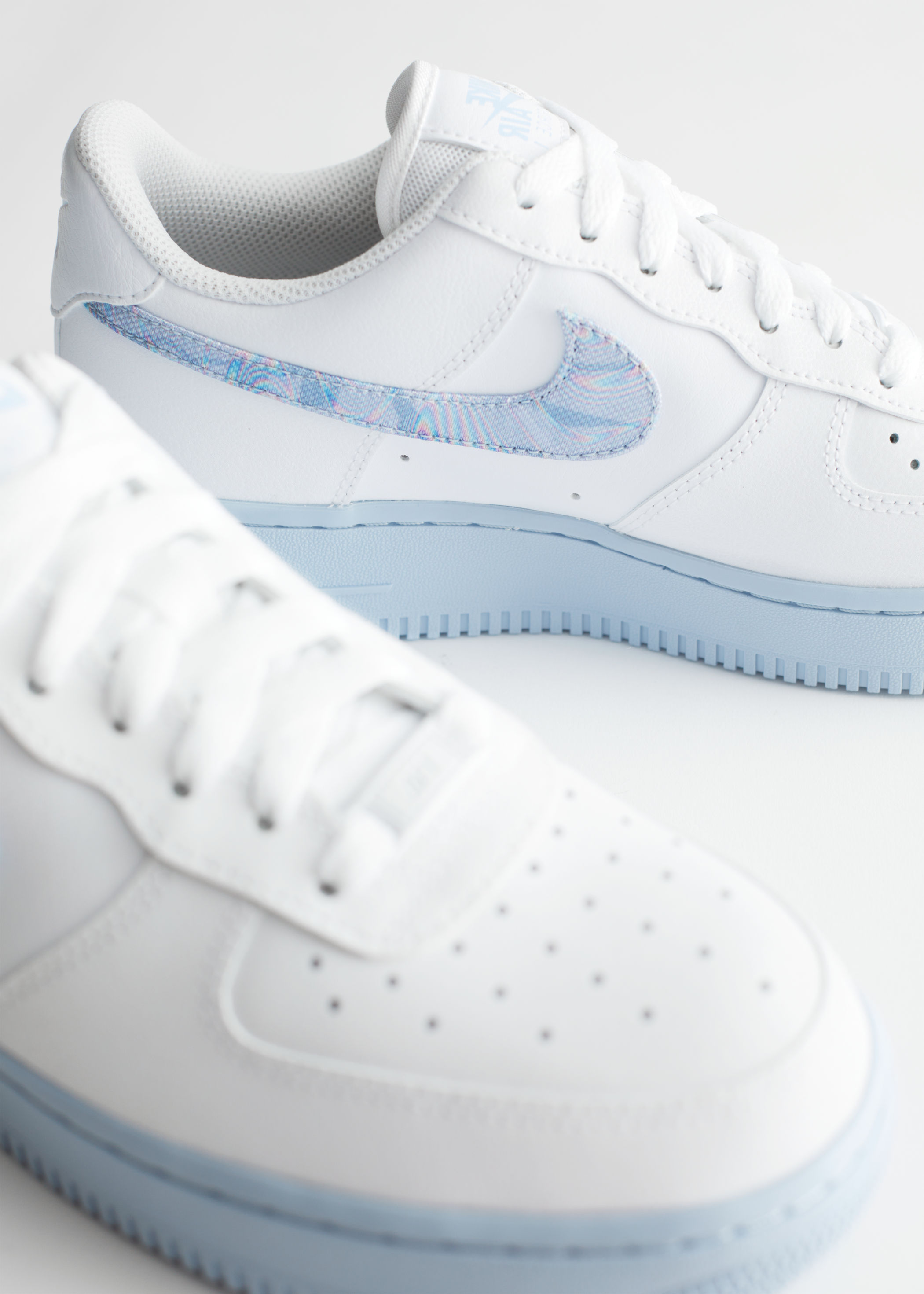 white air force 1 with holographic tick