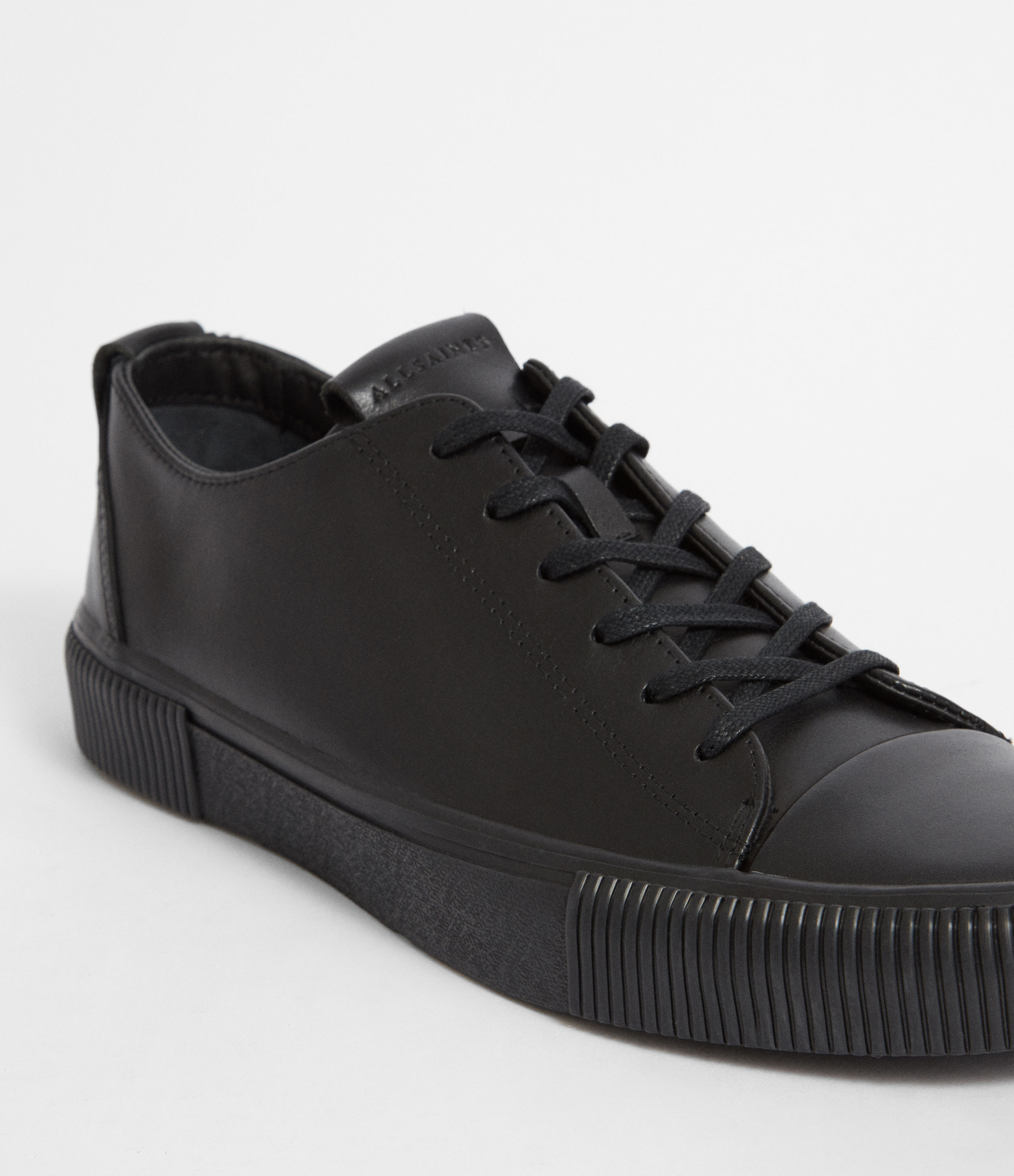 black leather low top trainers