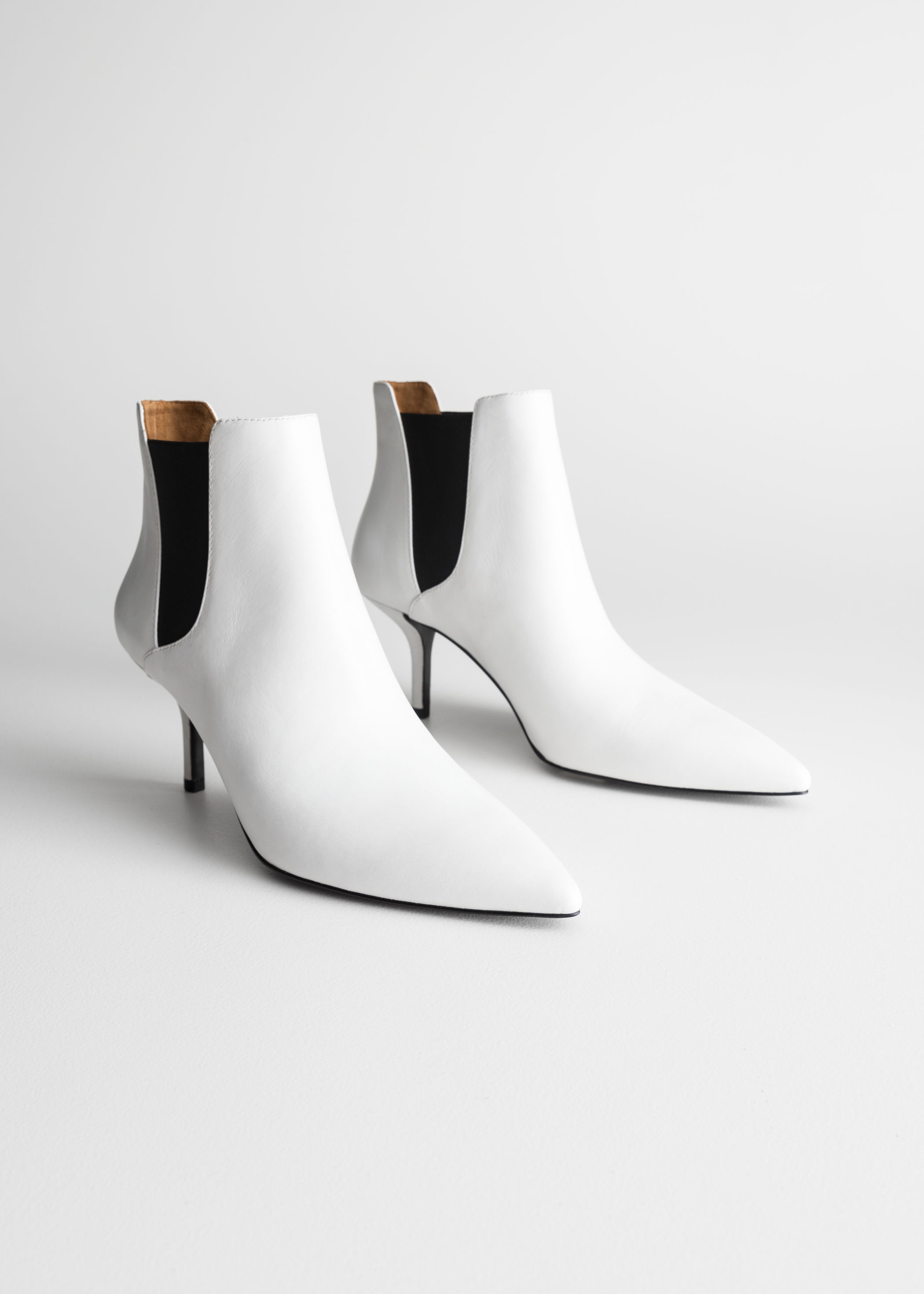 pointed white ankle boots